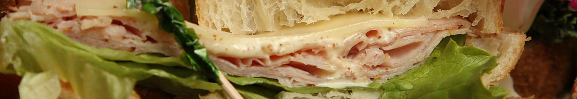 Eating Deli Sandwich at Sal's Deli restaurant in College Point, NY.